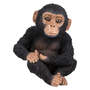Bambino scimpanzé seduto figura di decorazione
